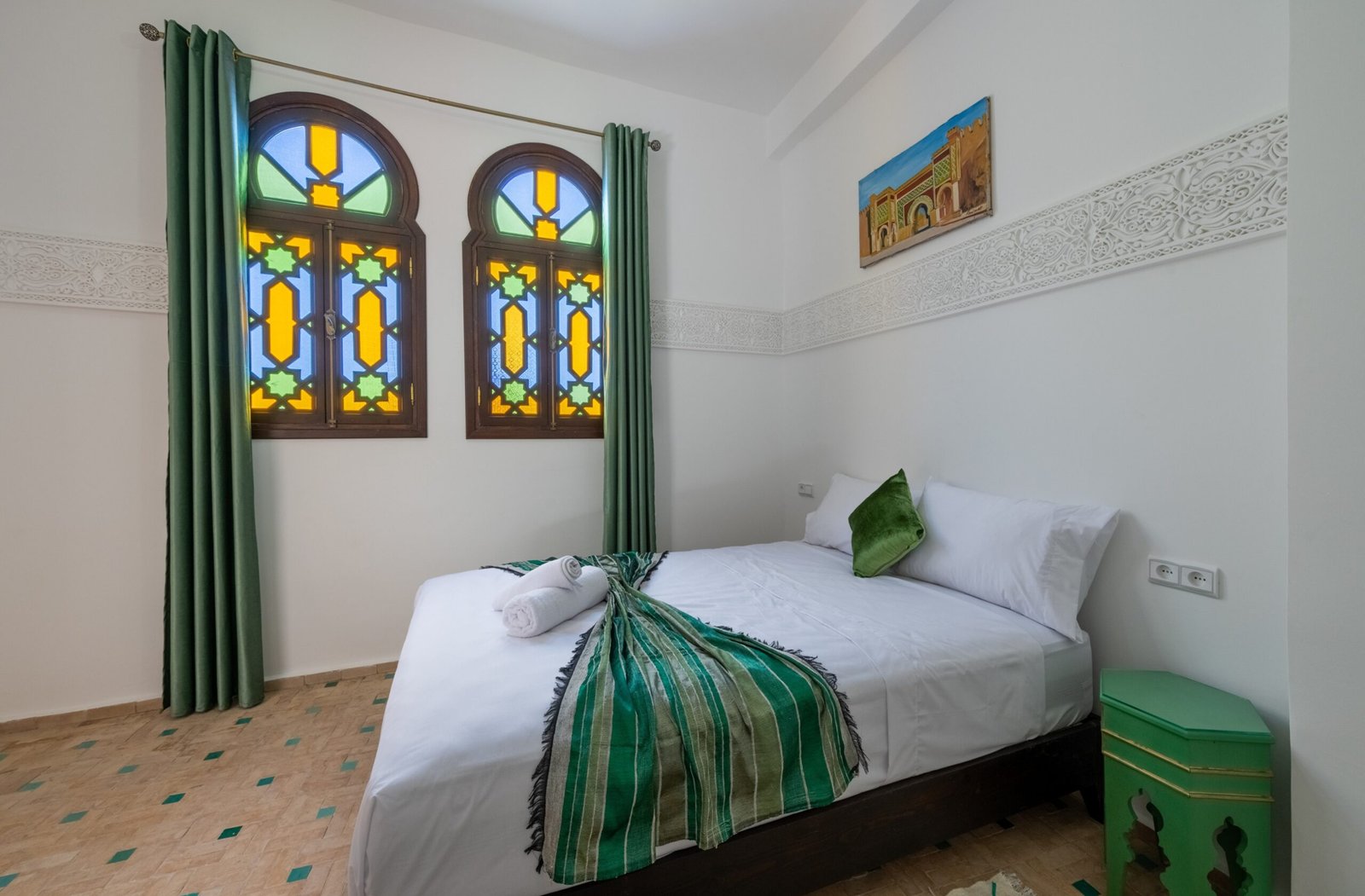 Bab Mansour Room with carved Moroccan details Tangier